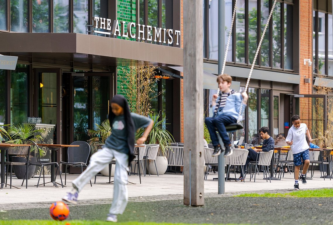 placemaking and lifestyle photography, london, nine elms, children playing outside bar