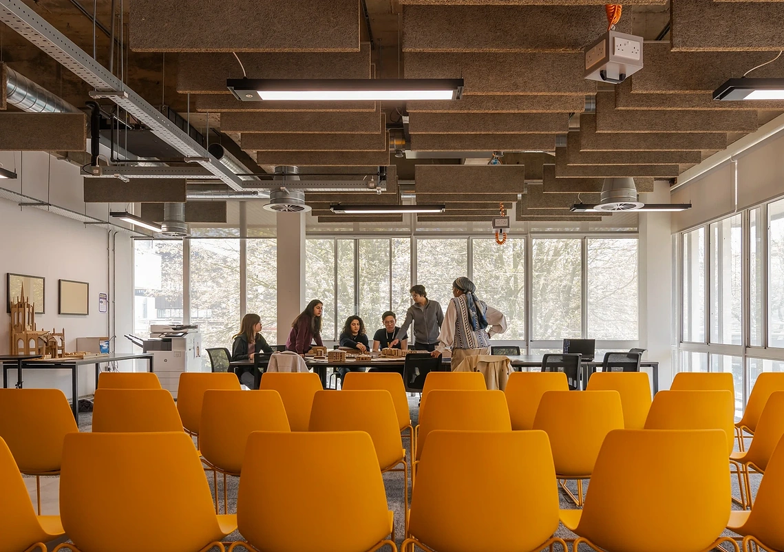 The hands-on design process and creative experimentation within the MSA studios with students and yellow chairs
