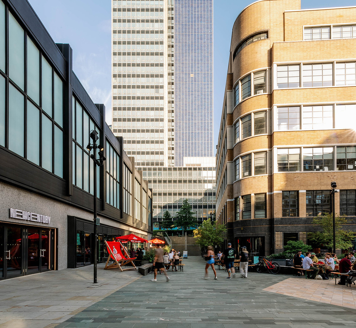 Independent Manchester business with the CIS Building behind, photographed for placemaking and branding context.  