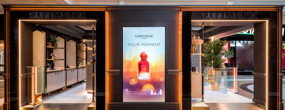 high end fragrance kiosk in situ in manchester Trafford Centre, shows interior with displays of products