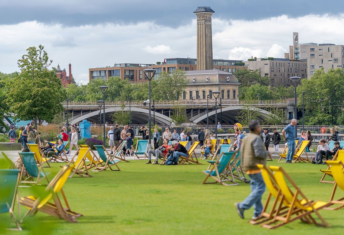 placemaking and lifestyle photography, london, battersea, outdoor space with deck chairs and public, view back over toward chelsea