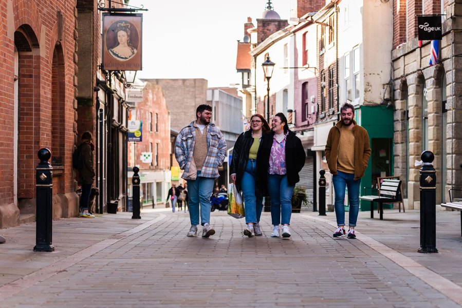 stockport lifestyle and placemaking photography, shoppers walking down local street