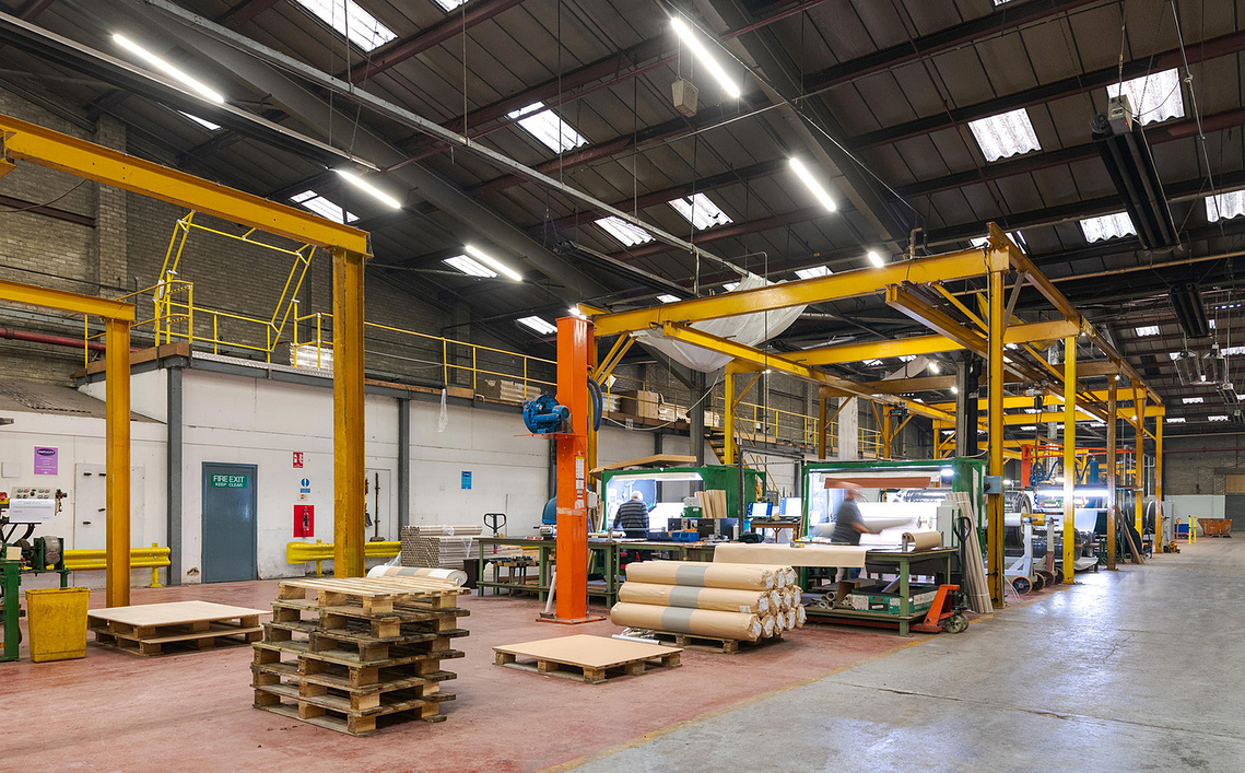Creative photography for manufacturing brands. Wide shot of factory capturing process
