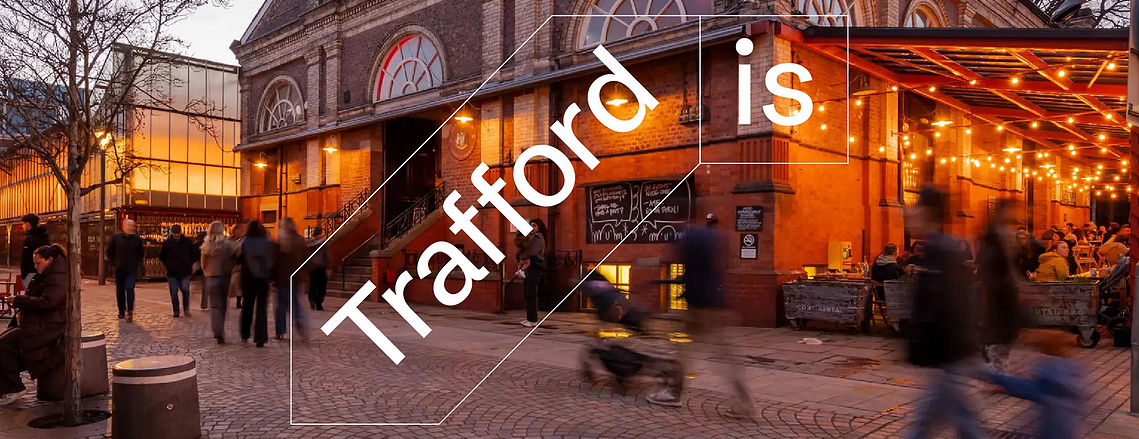 Destination marketing photography shows evening long exposure of Altrincham market with logo applied