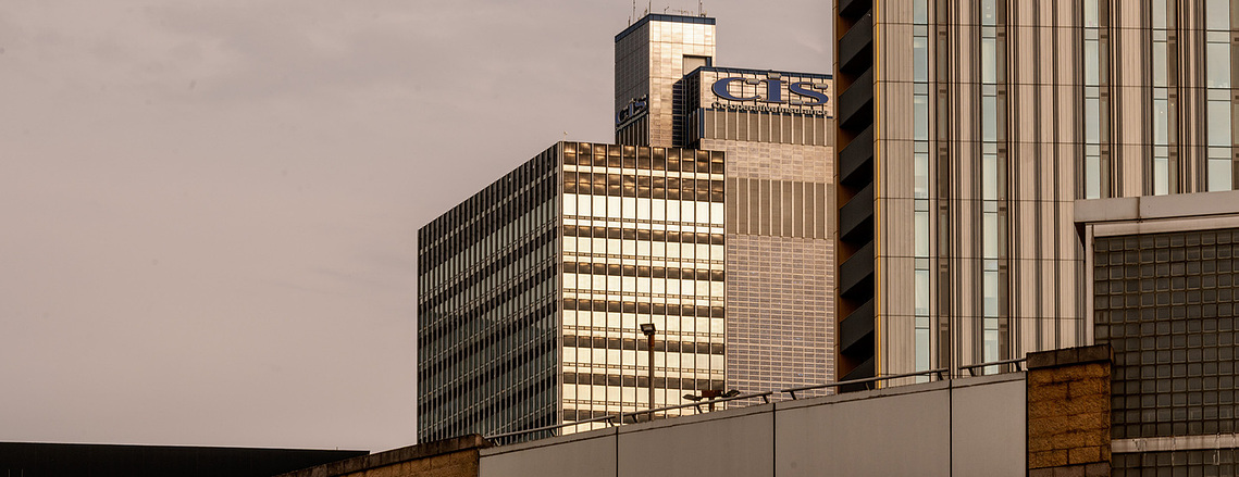 Placemaking architecture photography showing the CIS Building rising above Manchester. Evening light