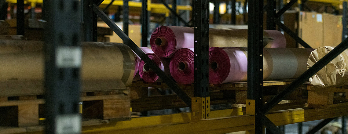 Creative photography for manufacturing brands showcasing fabric samples in storage