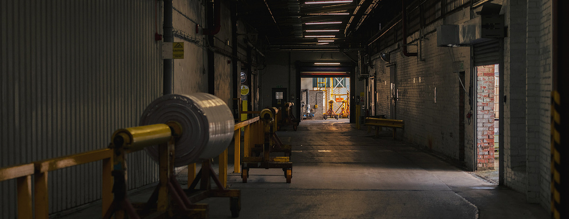 Creative photography for manufacturing brands showcasing warehouse space and light