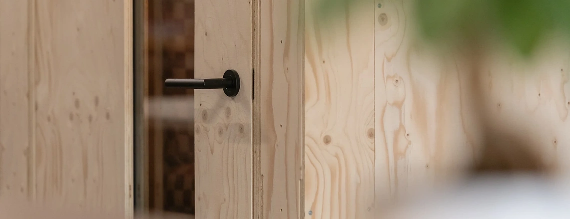 Close up of timber material in U-Build modular system in use in workspace