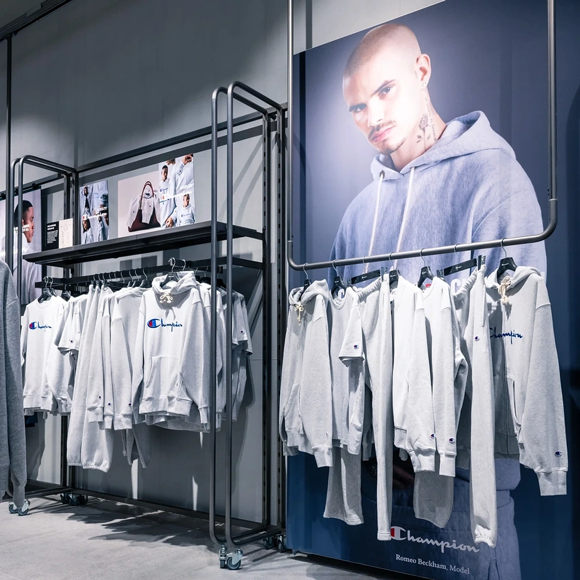 Commercial interior photography showing campaign branding and products in the Champion Manchester store.