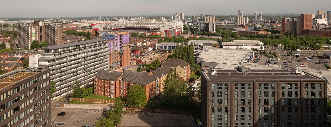 Elevated view from Podium across Old Trafford Stadium and the Manchester skyline.
