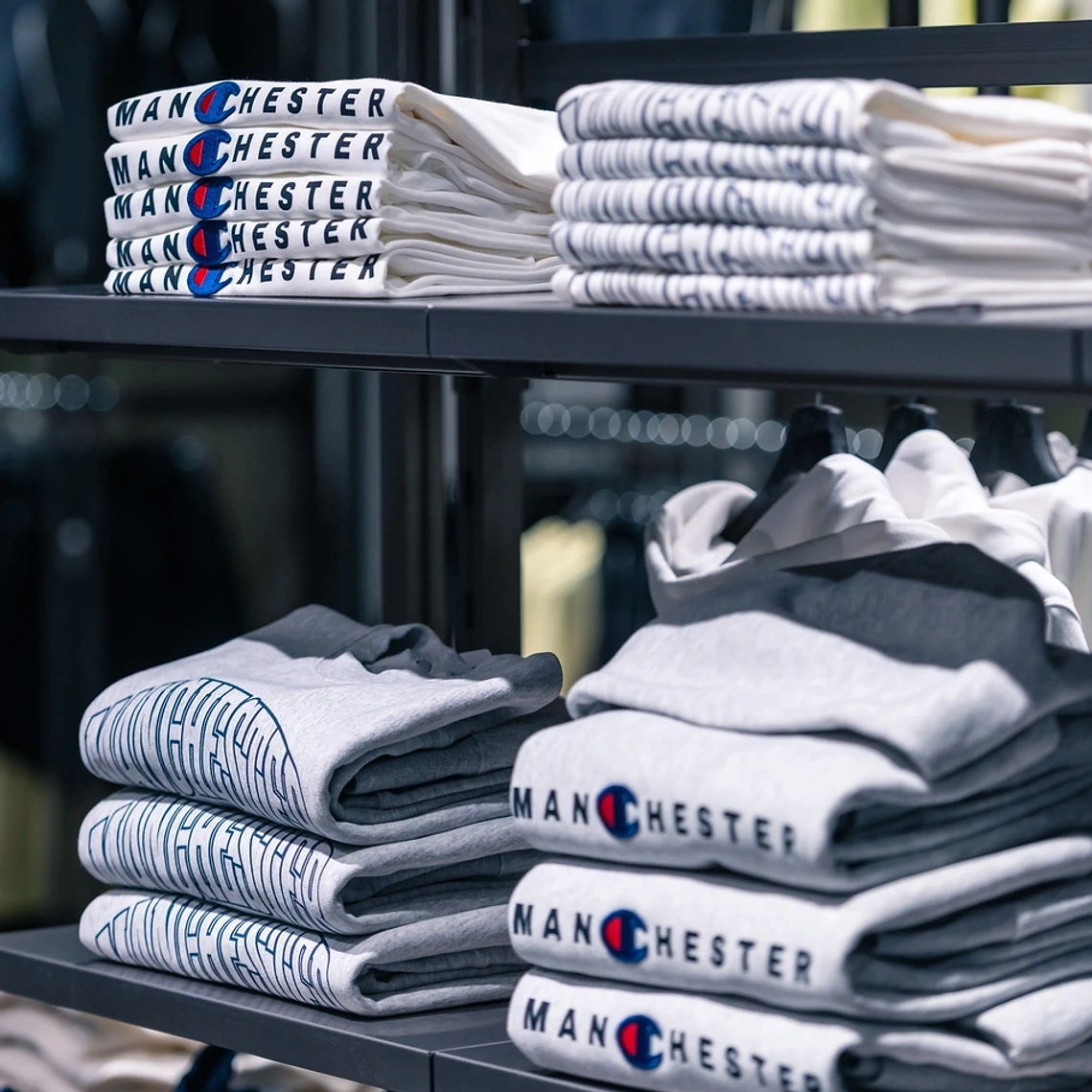 Commercial interior photography showing bespoke merchandising in Champion Manchester store.