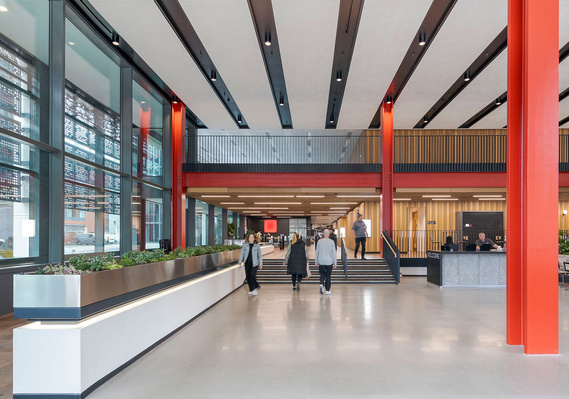 architecture photography and interior photography, large open plan space in commercial building, reception area, modern design, people walking down stairs