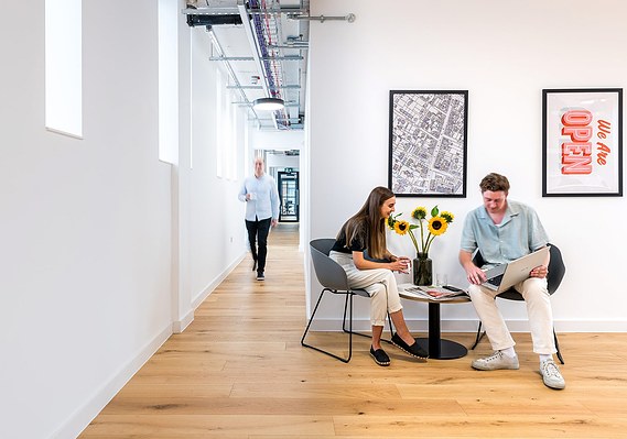 Case Study Photography Cover For Interior And Exterior Architectural Photography For Stanley Square In Sale showing workers interacting in modern workspace
