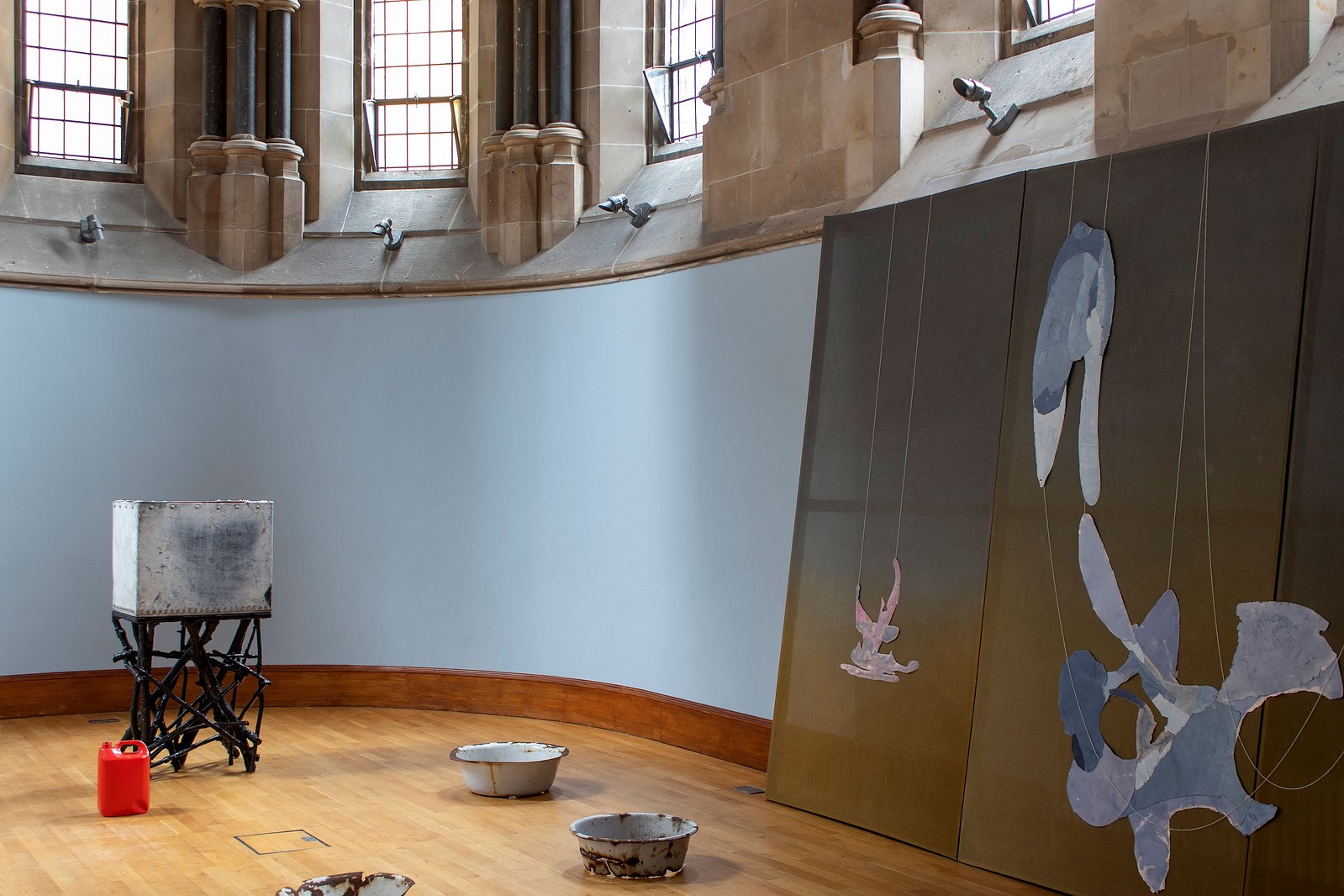 Blue curved chapel with painting and sculpture. Jamie Kane