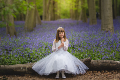 Holy Communion photography in London – elegant outdoor portrait of a child celebrating their First Communion in traditional attire
