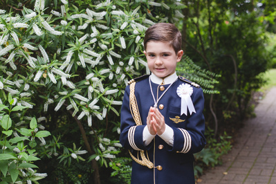 Natural light portrait of a boy on his First Holy Communion day, photographed in North East London. Specialising in Holy Communion photography for families across London and surrounding areas.