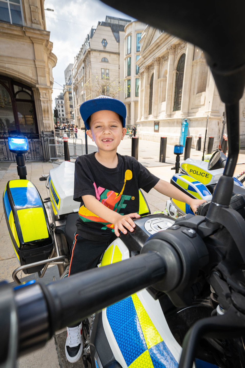 Child on a police motorbike