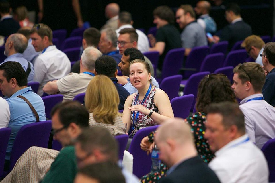 London conference main hall guests networking