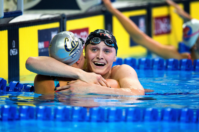 Kelsi Worrell, right, hugs Dana Vollmer, left, after she won the women's 100 meter butterfly final with a time of 56.48, during the 2016 U.S. Olympic Team Trials at the CenturyLink Center in Omaha, Neb., Monday, June 27th, 2016. MEGAN FARMER/THE WORLD-HER