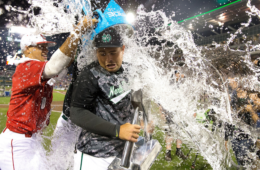 OMAHA, NEB. -- 07/02/2015:.North Dakota's Jeff Campbell gets dunked North Carolina State's Joe Dunand (left) and Miami's Zack Collins after winning the TD Ameritrade College Home Run Derby on Thursday, July 02, 2015. MEGAN FARMER/OMAHA WORLD-HERALD.