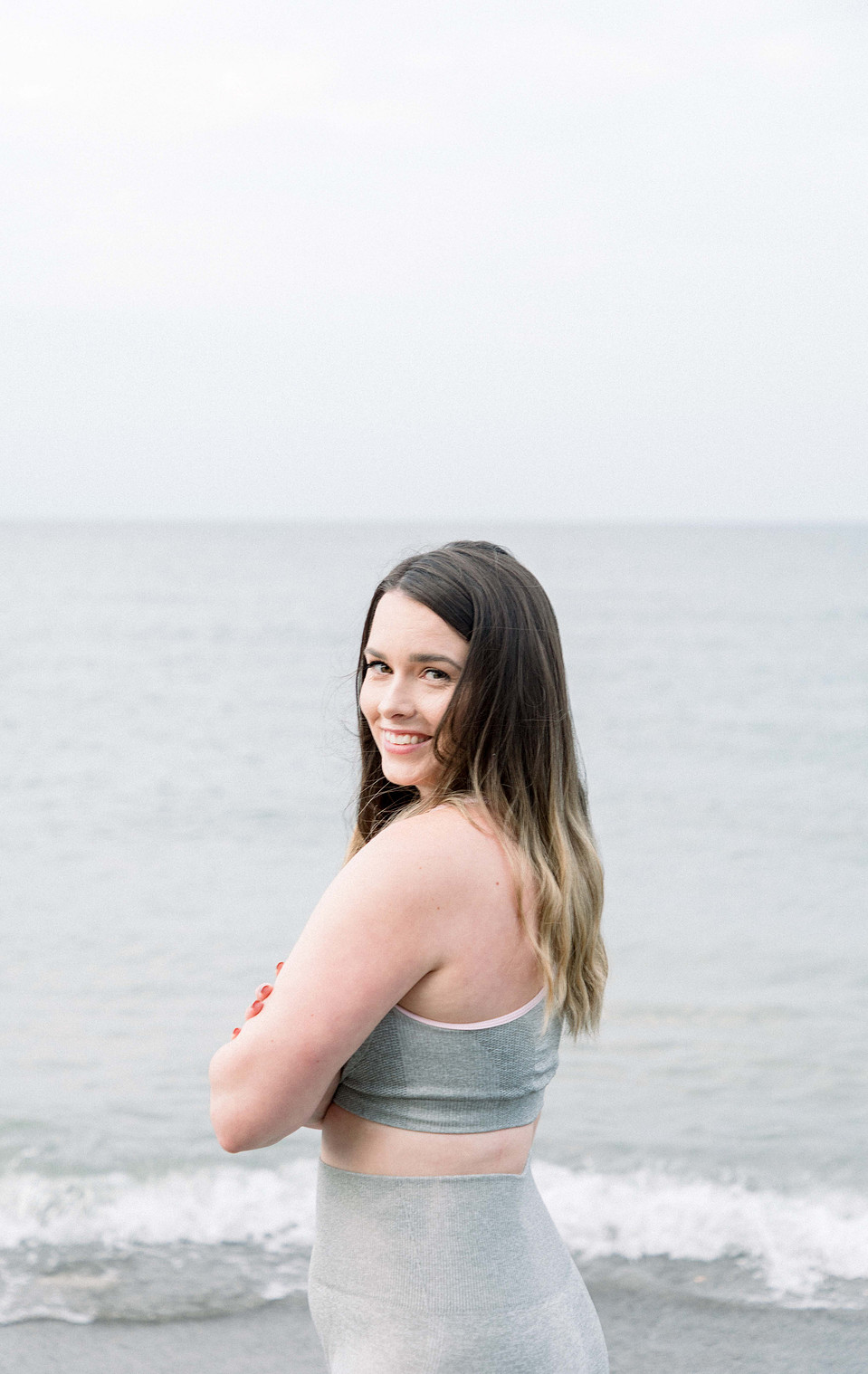 Portrait of female fitness model standing with her arms crossed, Niagara portrait photographer, Niagara branding photographer