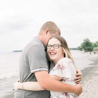 Candid portrait of couple hugging and laughing on the beach, Emily VanderBeek Photography, Portrait and Family photography, Niagara Photographer, Champlain Photographer, Vaudreuil-Soulanges Photographer, candid photography, authentic photography.