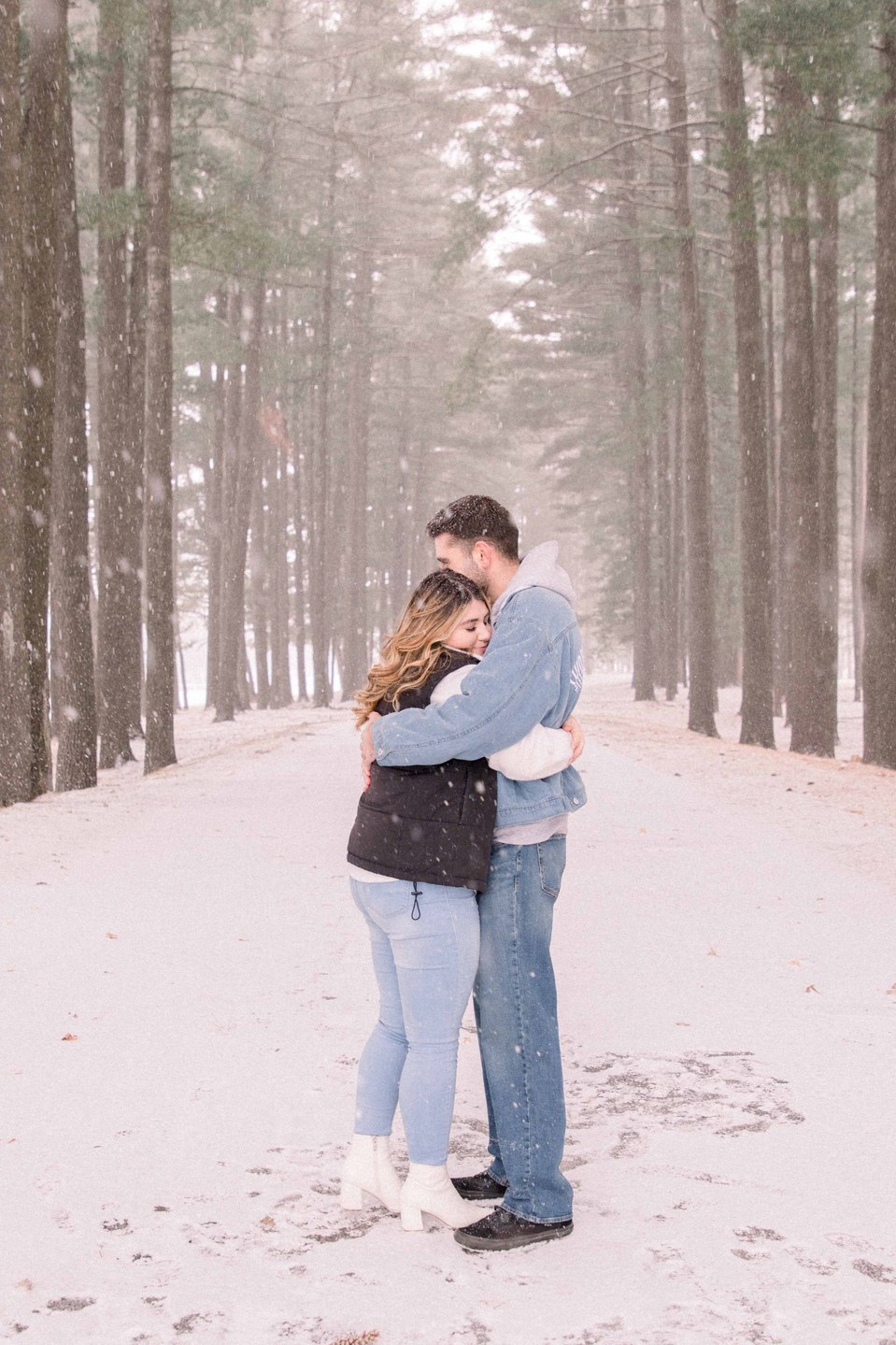 Portrait of young couple hugging each other on a winter trail, Niagara family photographer, family photography, Niagara portrait photographer, portrait photography, Champlain photographer, Hawkesbury photographer, Emily VanderBeek Photography.