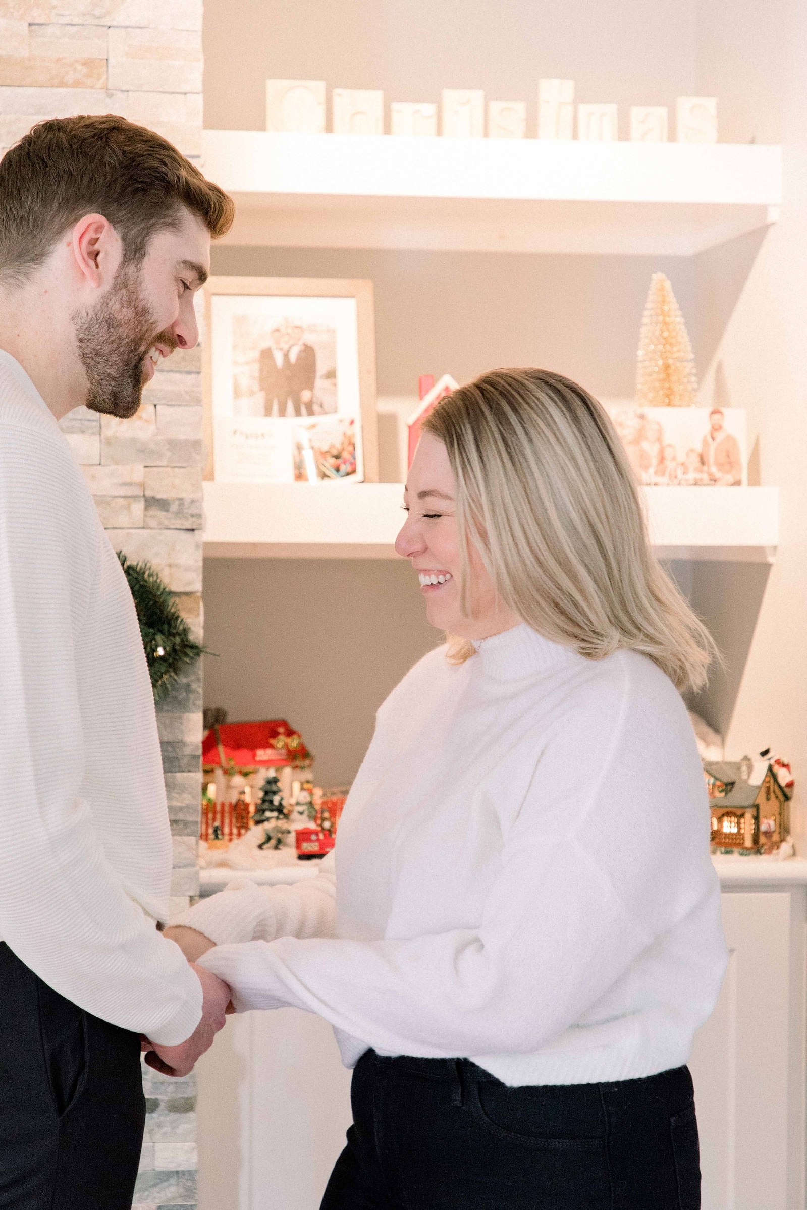 Cozy portrait of male & female couple inside their home. Surprise Proposal. Proposing. Christmas Photos. Ottawa Photographer. Vankleek Hill Photographer. Champlain Photographer. Emily VanderBeek Photography. Candid photography.