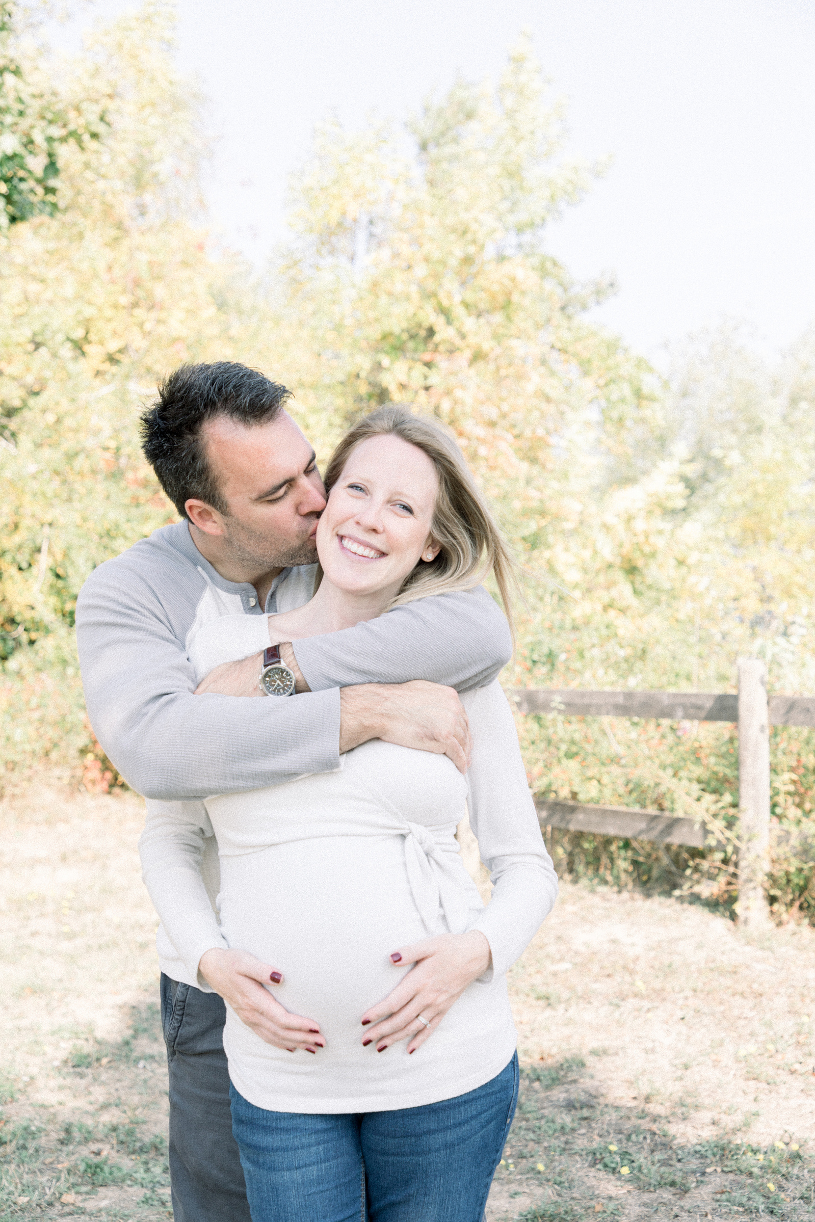 Portrait of husband hugging expecting wife, Niagara portrait photographer, Niagara family photographer, Niagara maternity photographer, maternity photography, candid photography.