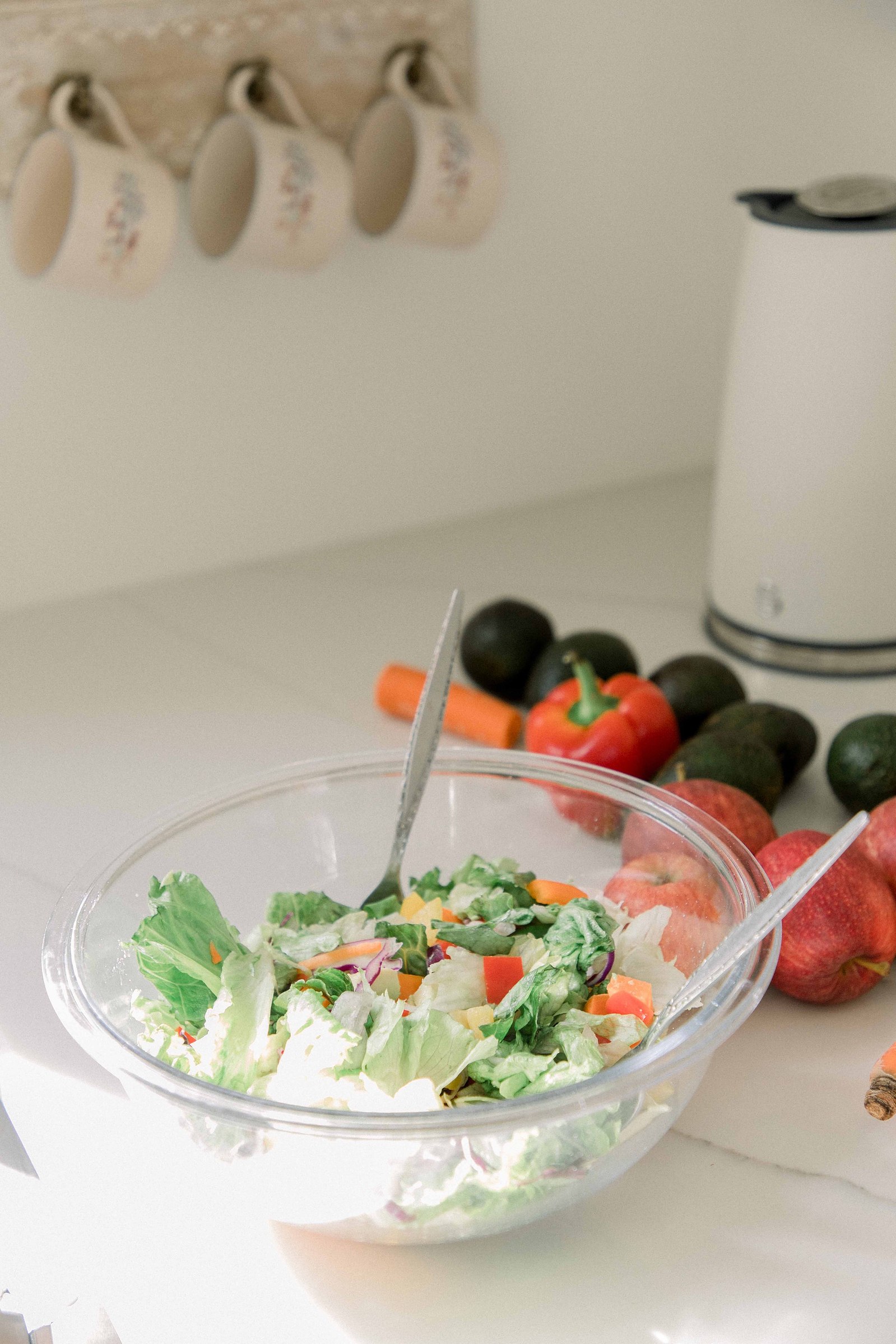 Photo of a salad on the counter of a studio kitchen. Light and airy photography. Emily VanderBeek Photography. Niagara Photographer, Ottawa Photographer, Montreal Photographer.