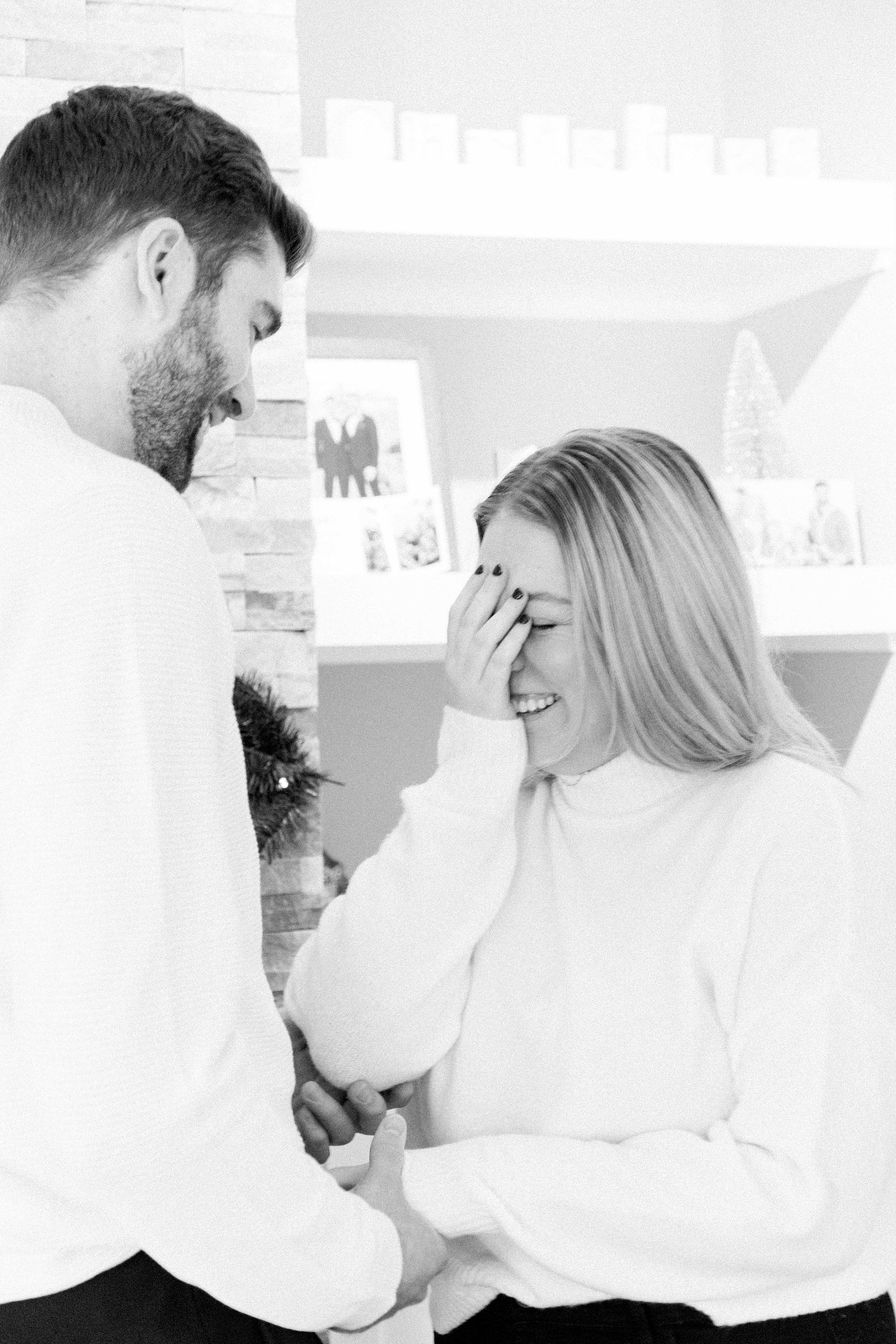 Cozy portrait of male & female couple inside their home. Surprise Proposal. Proposing. Christmas Photos. Ottawa Photographer. Vankleek Hill Photographer. Champlain Photographer. Emily VanderBeek Photography. Candid photography.