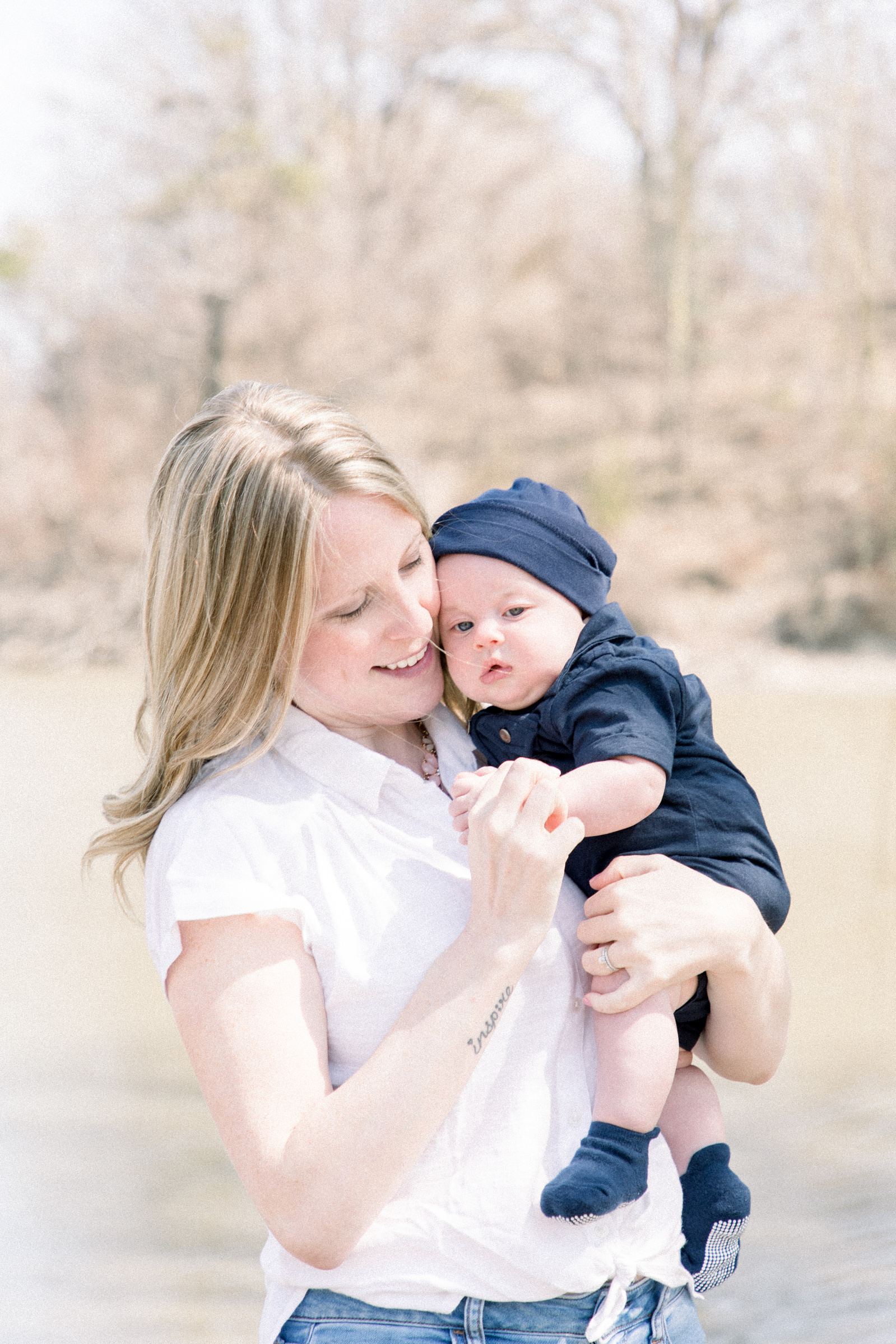 Portrait of mother holding her baby boy, Niagara portrait photographer, Niagara family photographer, family photography, candid photography.