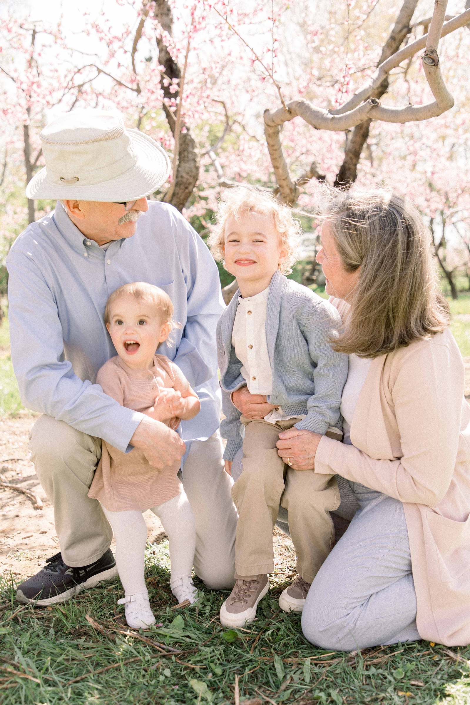 Extended family photo taken in an orchard. Spring Session. Family Photography. Niagara Family Photography, Niagara Portrait Photographer. Jordan, Ontario. Emily VanderBeek Photography.
