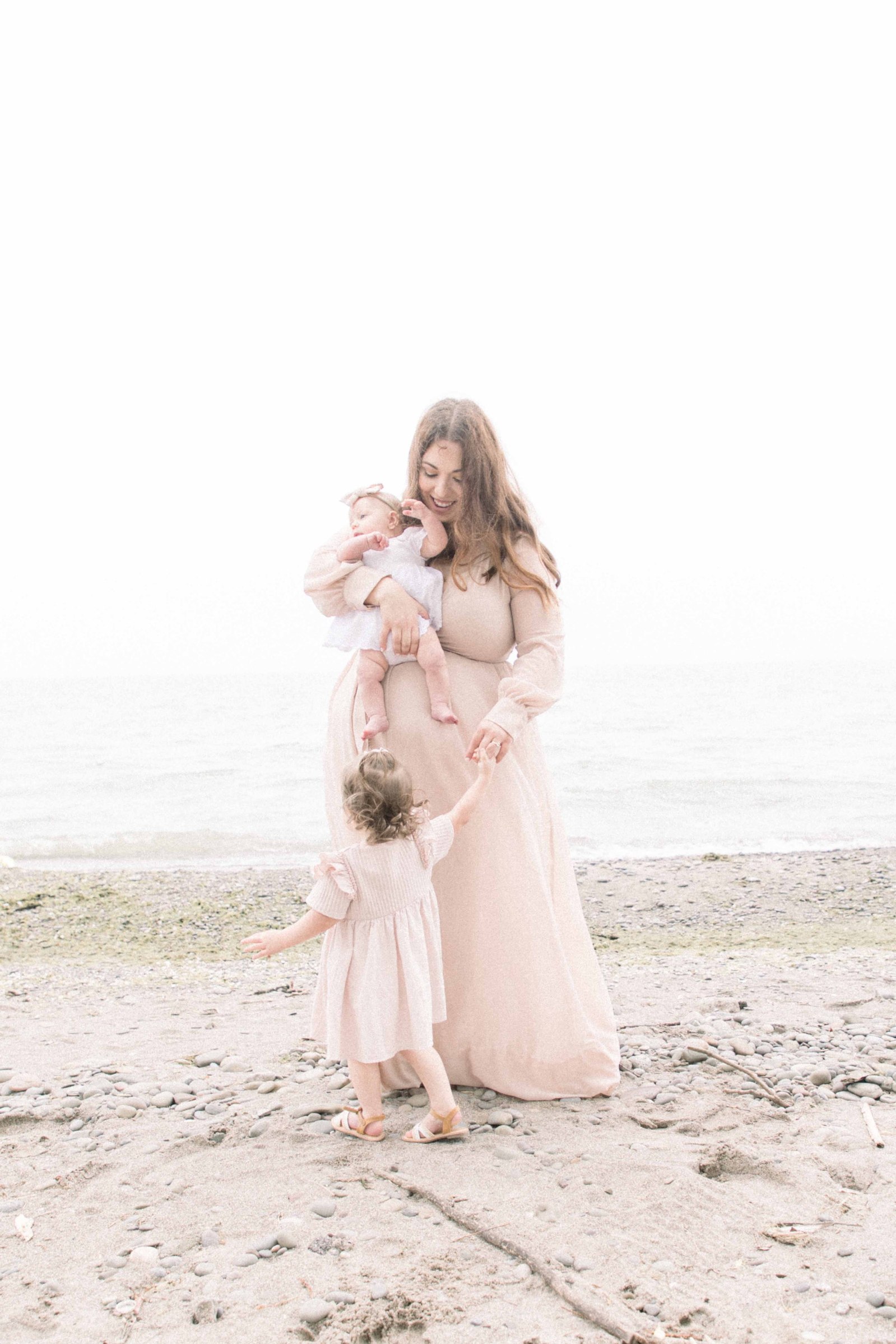 Portrait of mother and two daughters dancing on the beach, Niagara Portrait Photographer, Niagara Family Photographer, Niagara Motherhood Photography, Beach Portrait Photography, Emily VanderBeek Photography.