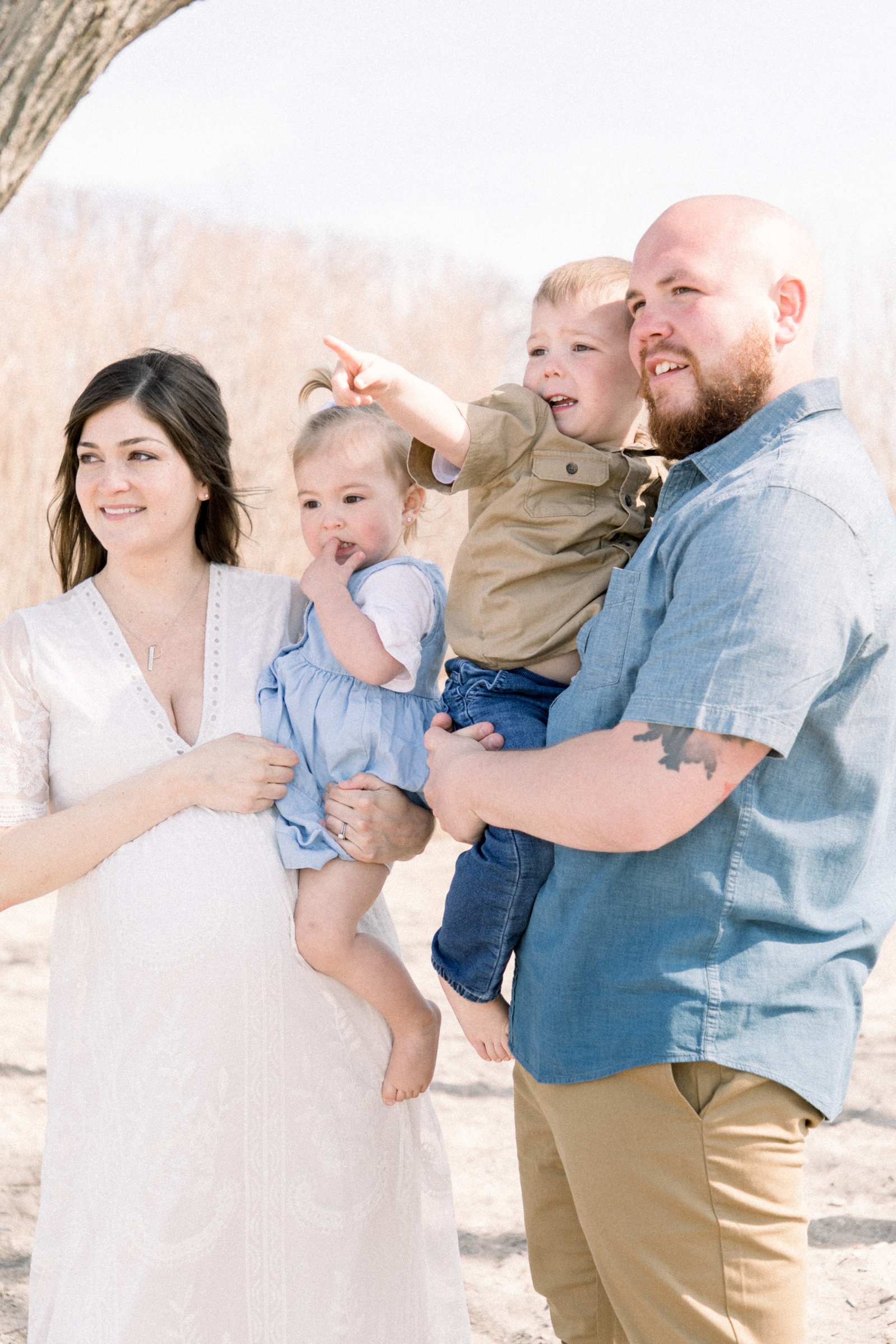 Portrait of a family of four with an expectant mother, Niagara maternity photography, Niagara family photography, beach photo session