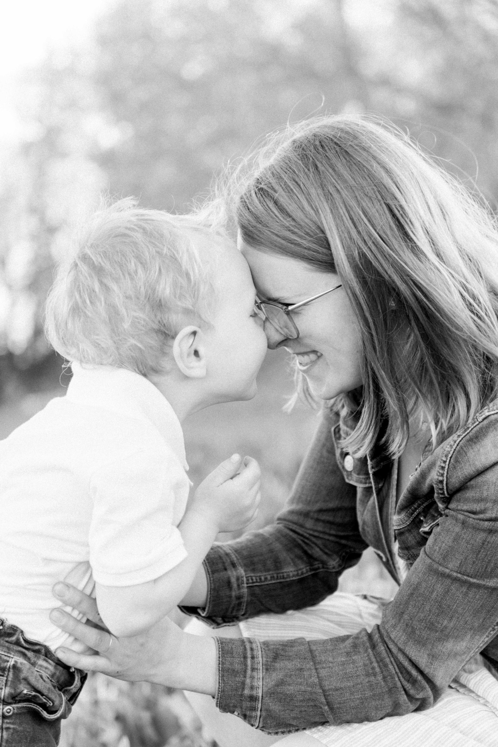 Black and white portrait of a mother and son touching noses. Vankleek Hill Portrait Photographer, L'Orignal, Champlain, Prescott-Russell, Family Photography, Candid Photography, Natural Photographer, Emily VanderBeek Photography.