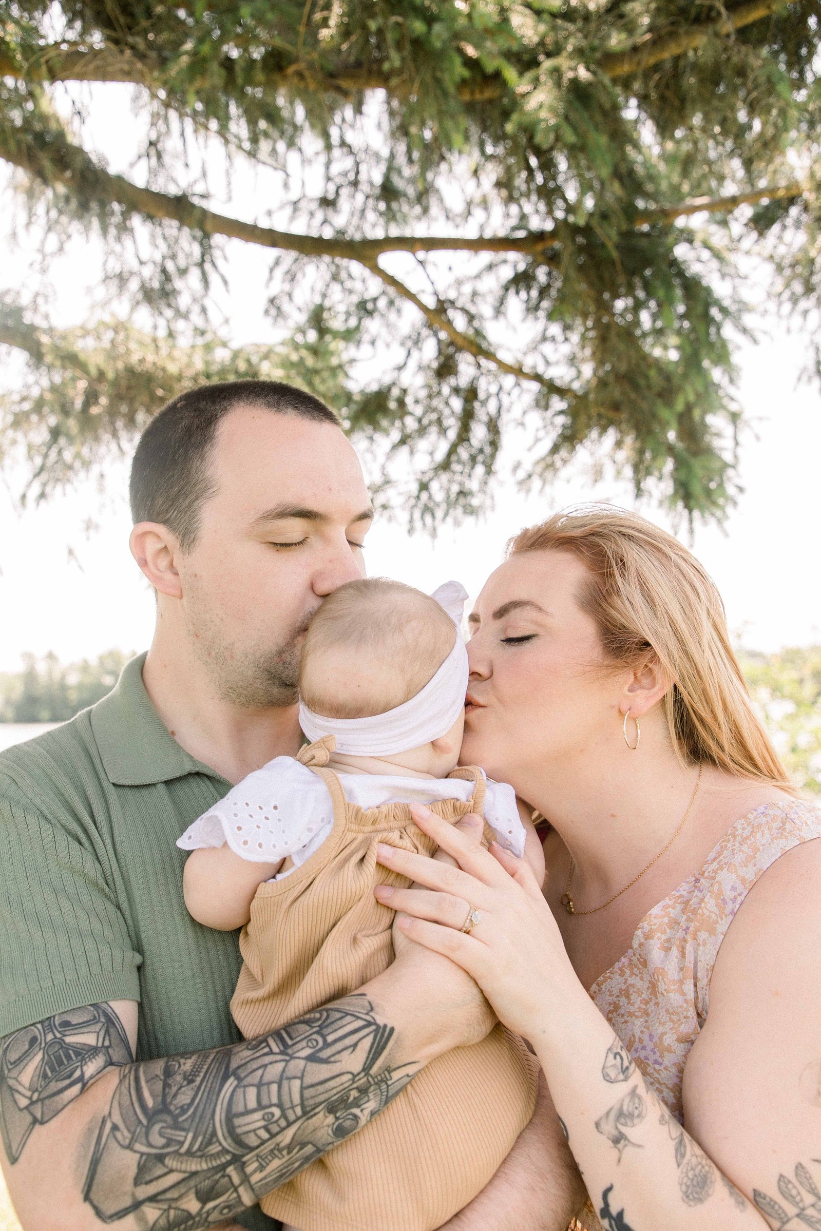 Portrait of a family of three in front of Ottawa River in Hawkesbury, Portrait Photographer, Family Photographer, Emily VanderBeek Photography, Candid Photography, making memories.