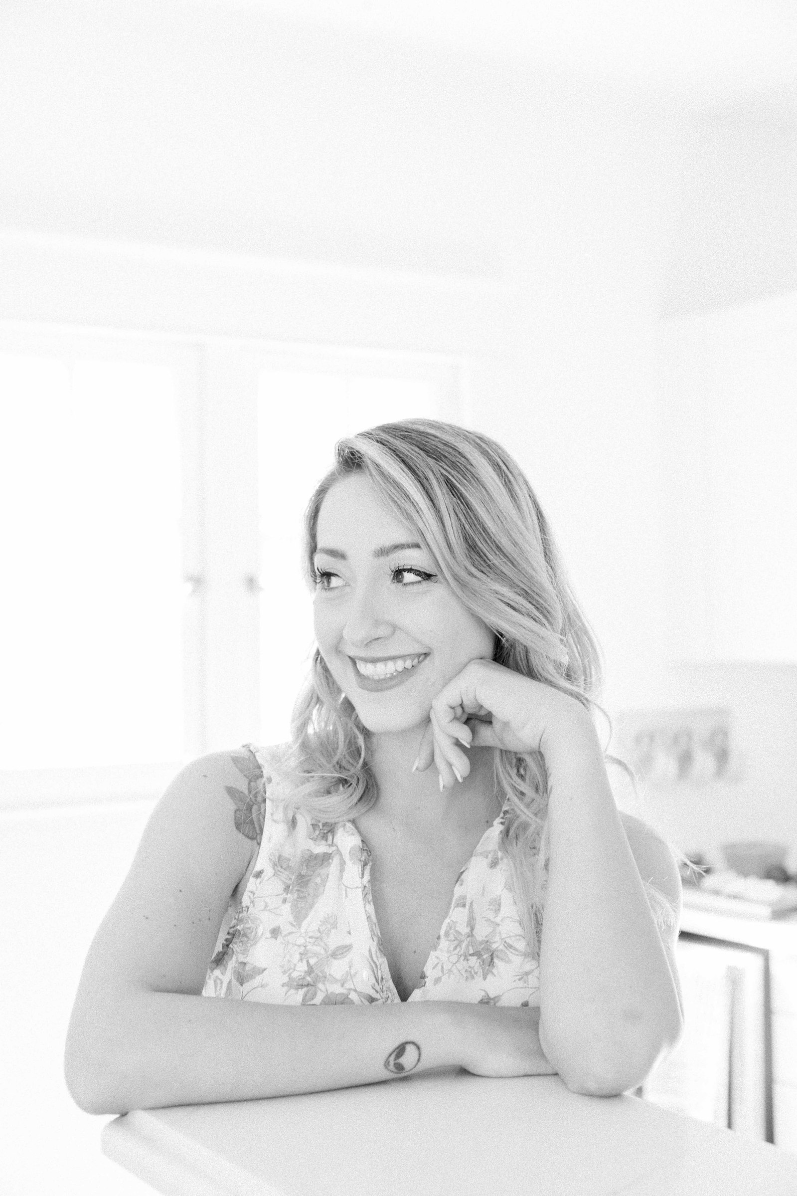 Black and white portrait of a woman in a studio kitchen. Light and airy photography. Emily VanderBeek Photography. Niagara Photographer, Ottawa Photographer, Montreal Photographer.