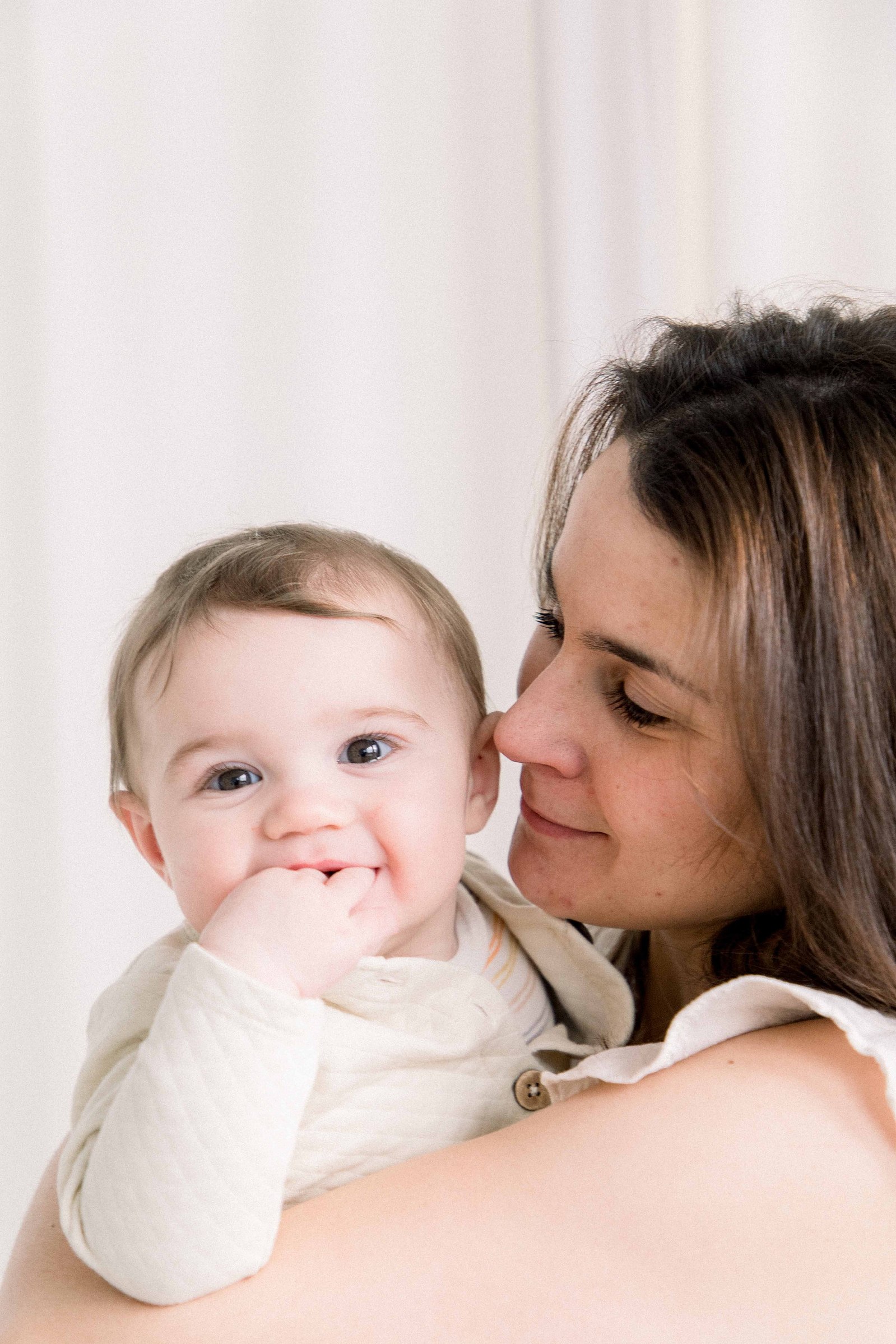 Portrait of a mom holding her baby boy in a studio. Emily VanderBeek Photography. Ottawa family photographer. Candid photography.