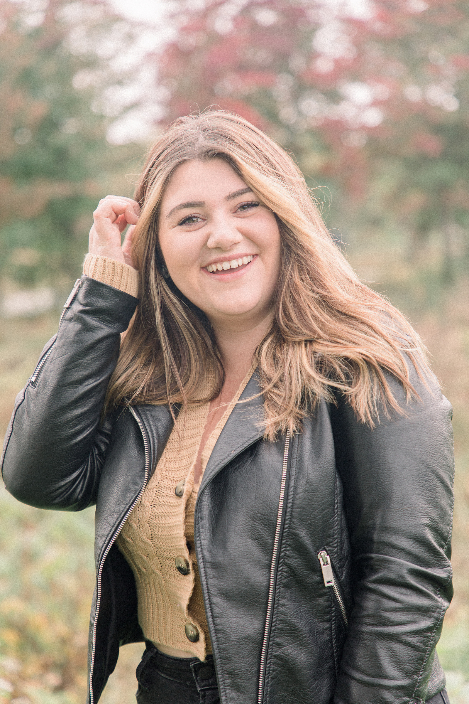Portrait of woman playing with her hair and laughing, L'Orignal family photographer, Champlain family photographer, Hawkesbury family photographer, Quebec family photography, Vaudreuil-Soulanges Photographer, Emily VanderBeek Photography.