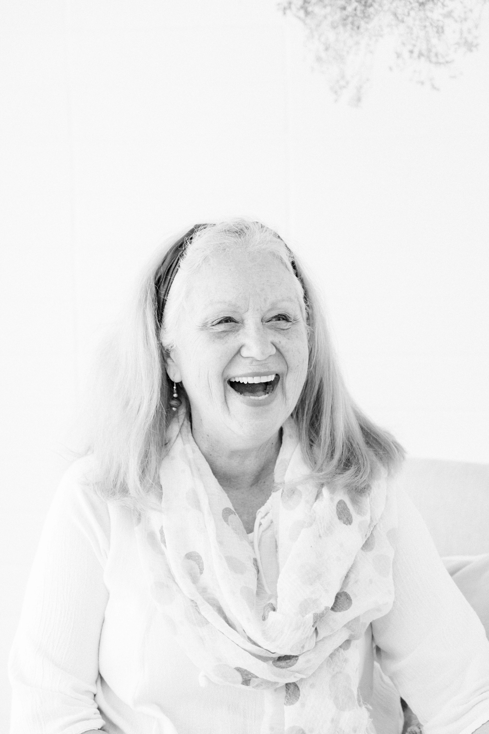 Black and white portrait of woman laughing. Emily VanderBeek Photography, branding photography, portrait photography, Niagara portrait photographer, Niagara branding photographer.