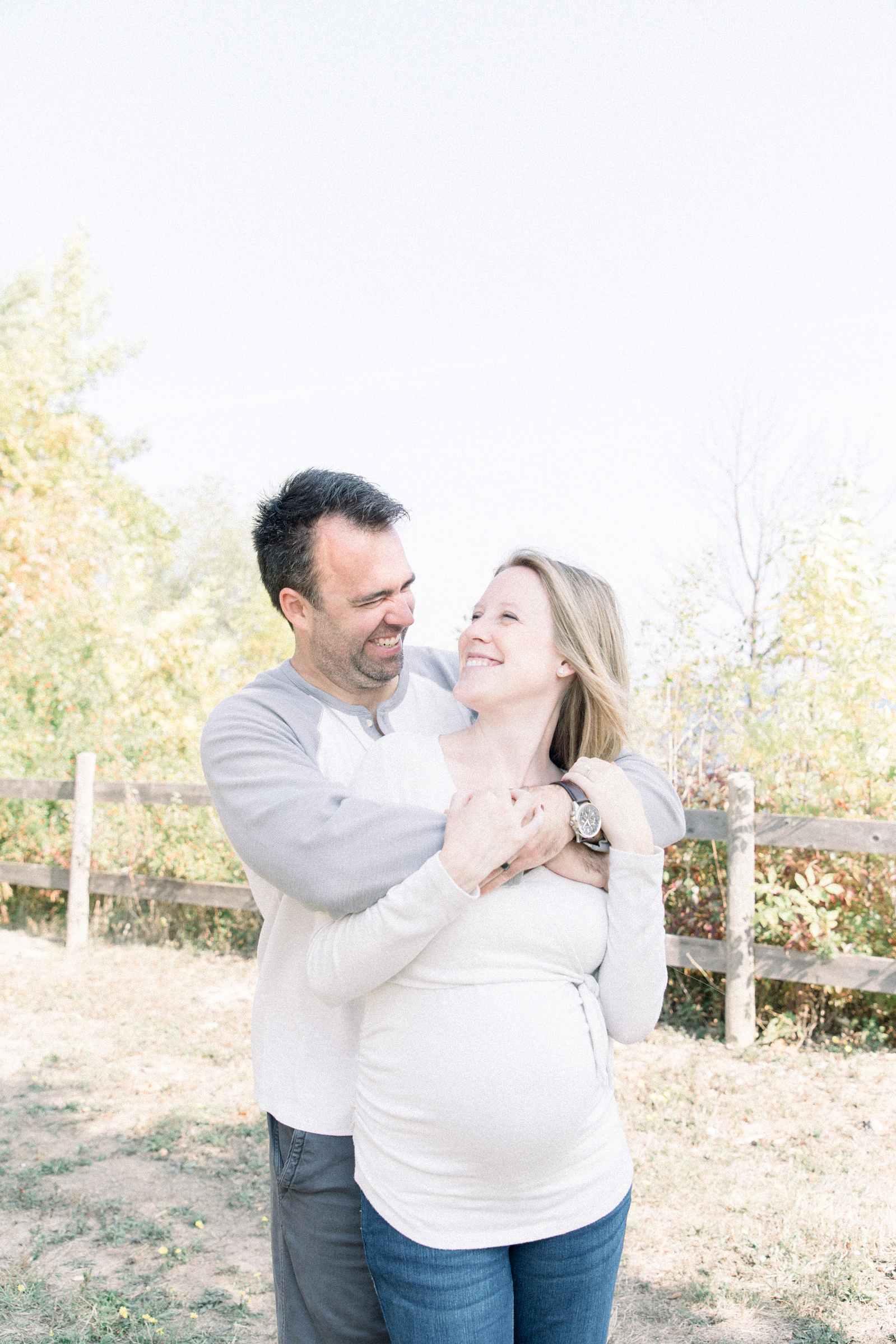Portrait of husband hugging expecting wife, Niagara portrait photographer, Niagara family photographer, Niagara maternity photographer, maternity photography, candid photography.