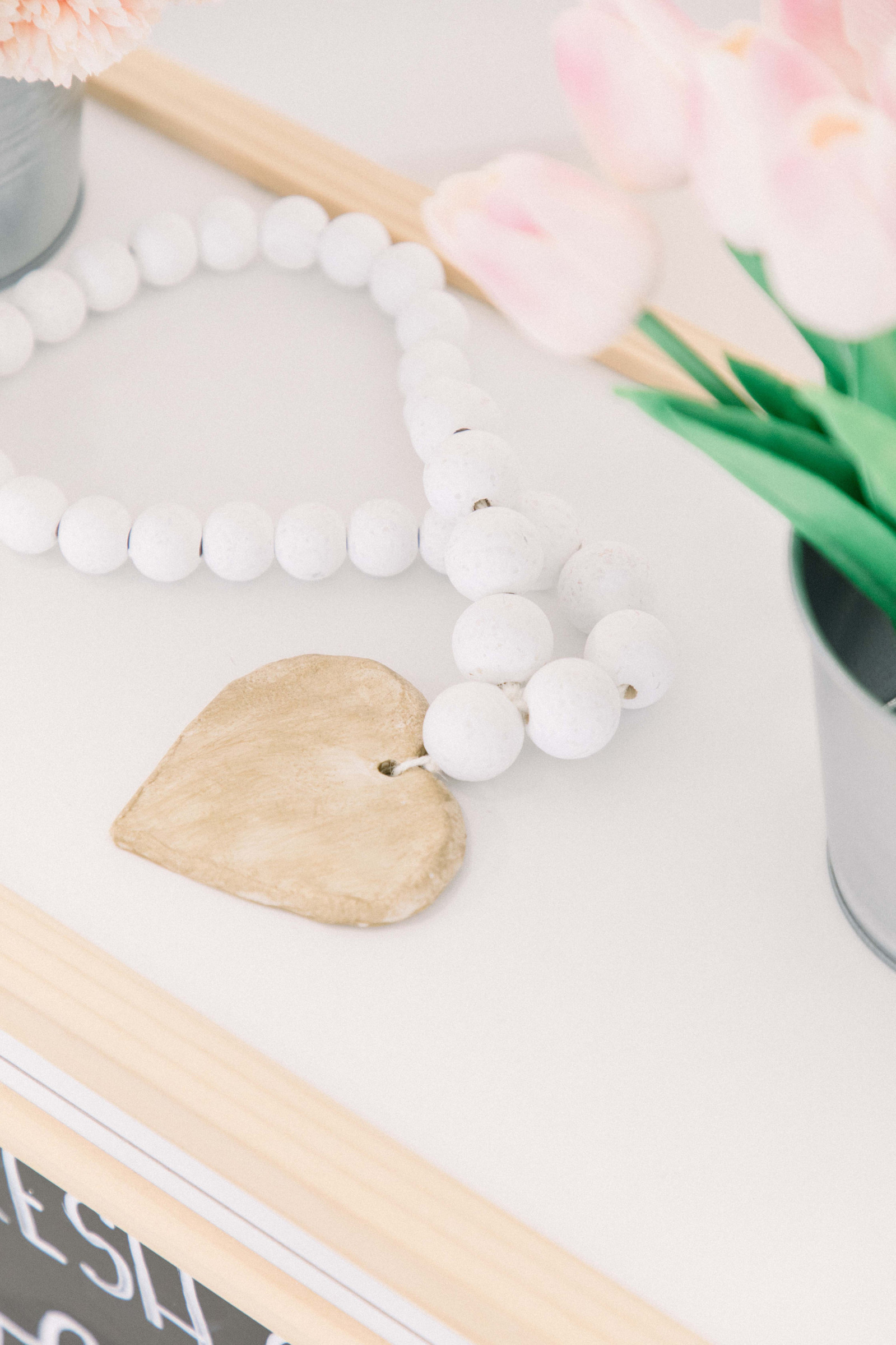 Product photo of handmade white wooden garland. Emily VanderBeek Photography, branding photography, portrait photography, Niagara portrait photographer, Niagara branding photographer.