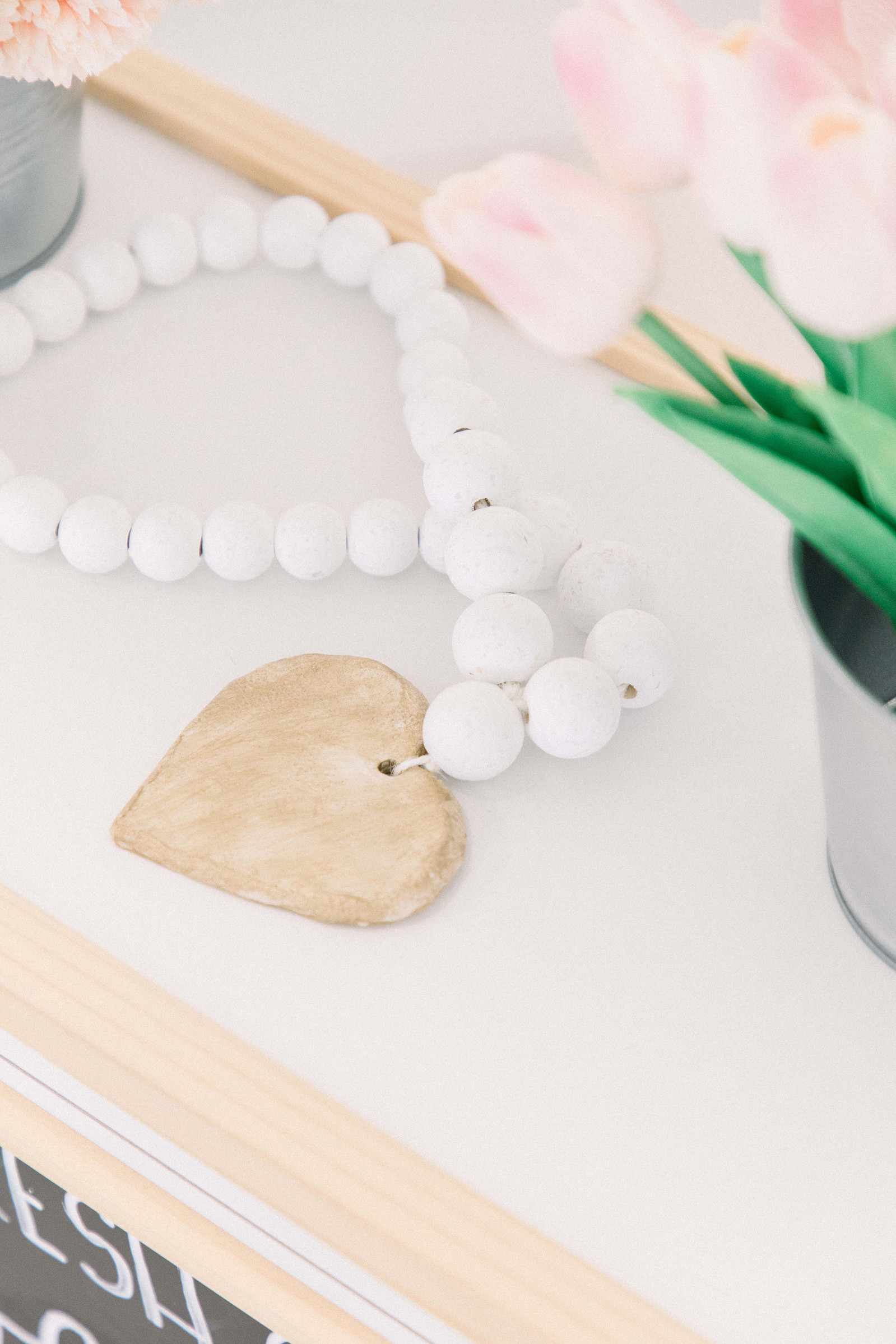 Product photo of handmade white wooden garland. Emily VanderBeek Photography, branding photography, portrait photography, Niagara portrait photographer, Niagara branding photographer.