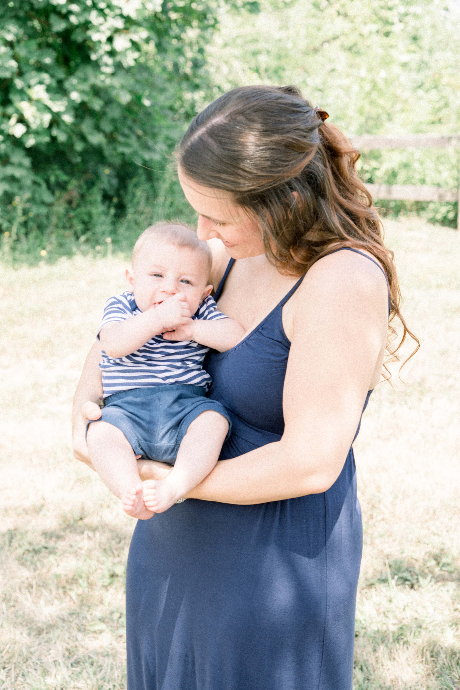 Portrait of mother holding baby boy outside, Emily VanderBeek Photography, Portrait and Family photography, Niagara Photographer, Champlain Photographer, Vaudreuil-Soulanges Photographer, candid photography, authentic photography.