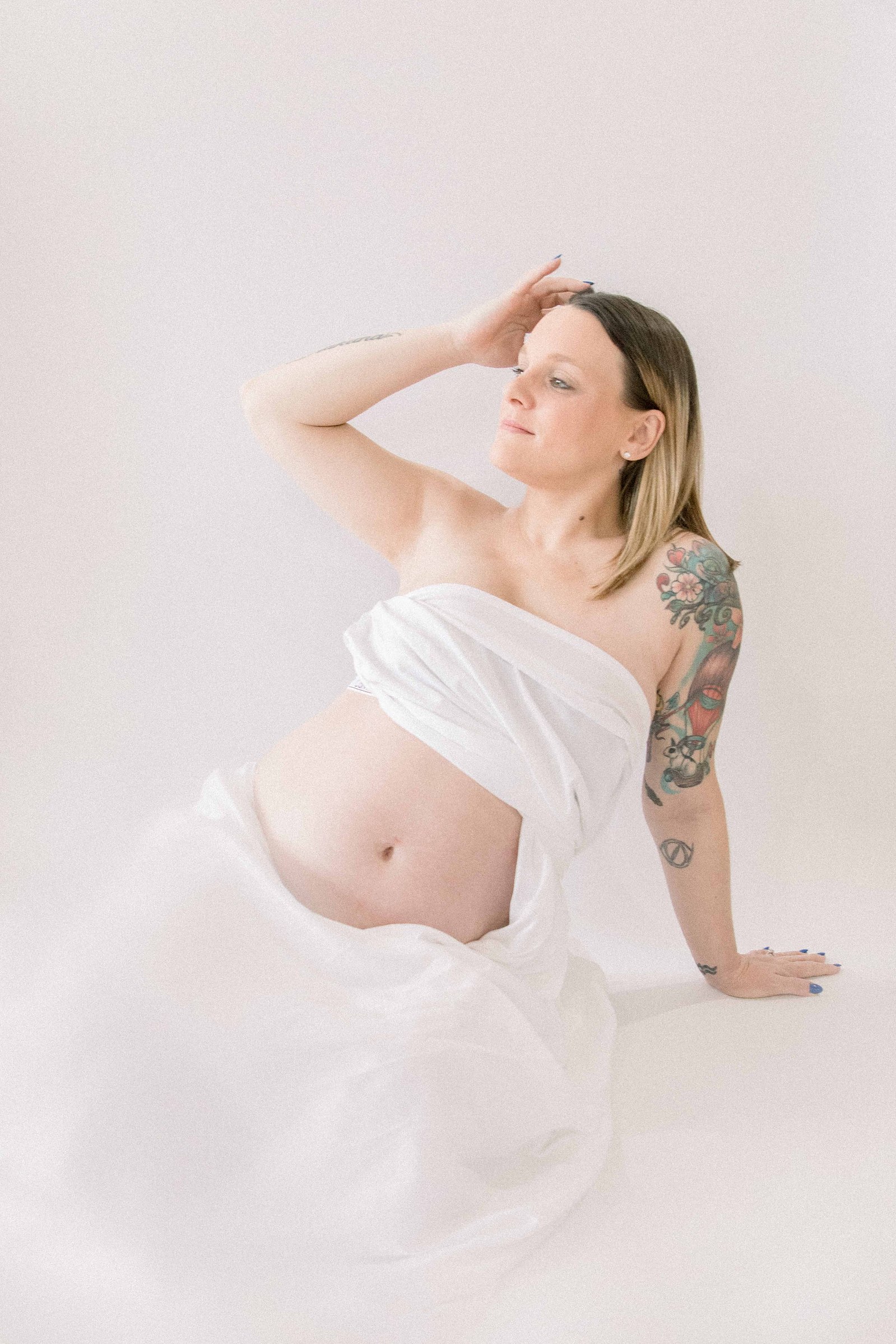 Studio portrait of a pregnant mother. Ottawa Maternity Photographer, Montreal Maternity Photographer, Motherhood Photography, Authentic Photography, Light & Airy Photography, Emily VanderBeek Photography.