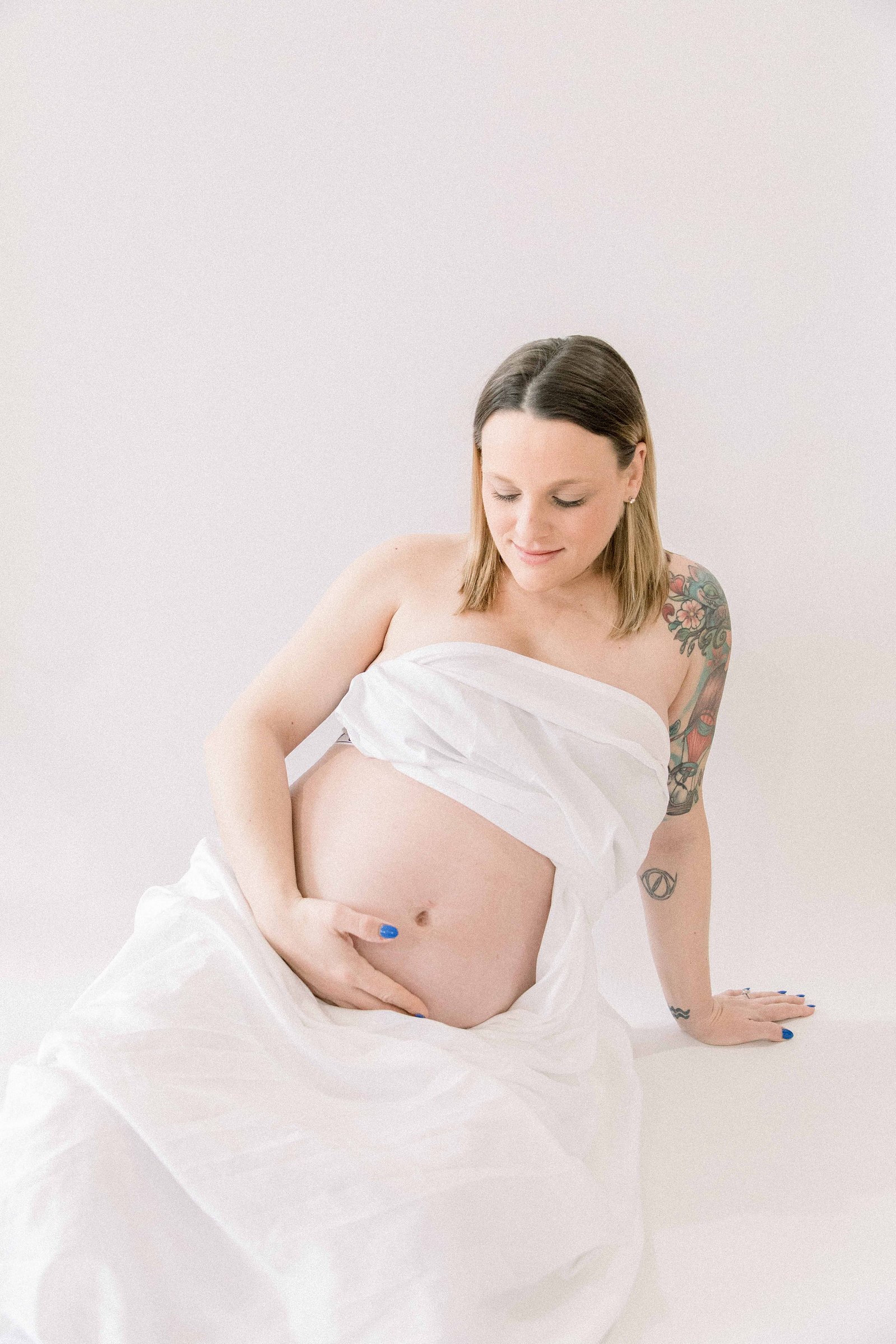 Studio portrait of a pregnant mother. Ottawa Maternity Photographer, Montreal Maternity Photographer, Motherhood Photography, Authentic Photography, Light & Airy Photography, Emily VanderBeek Photography.