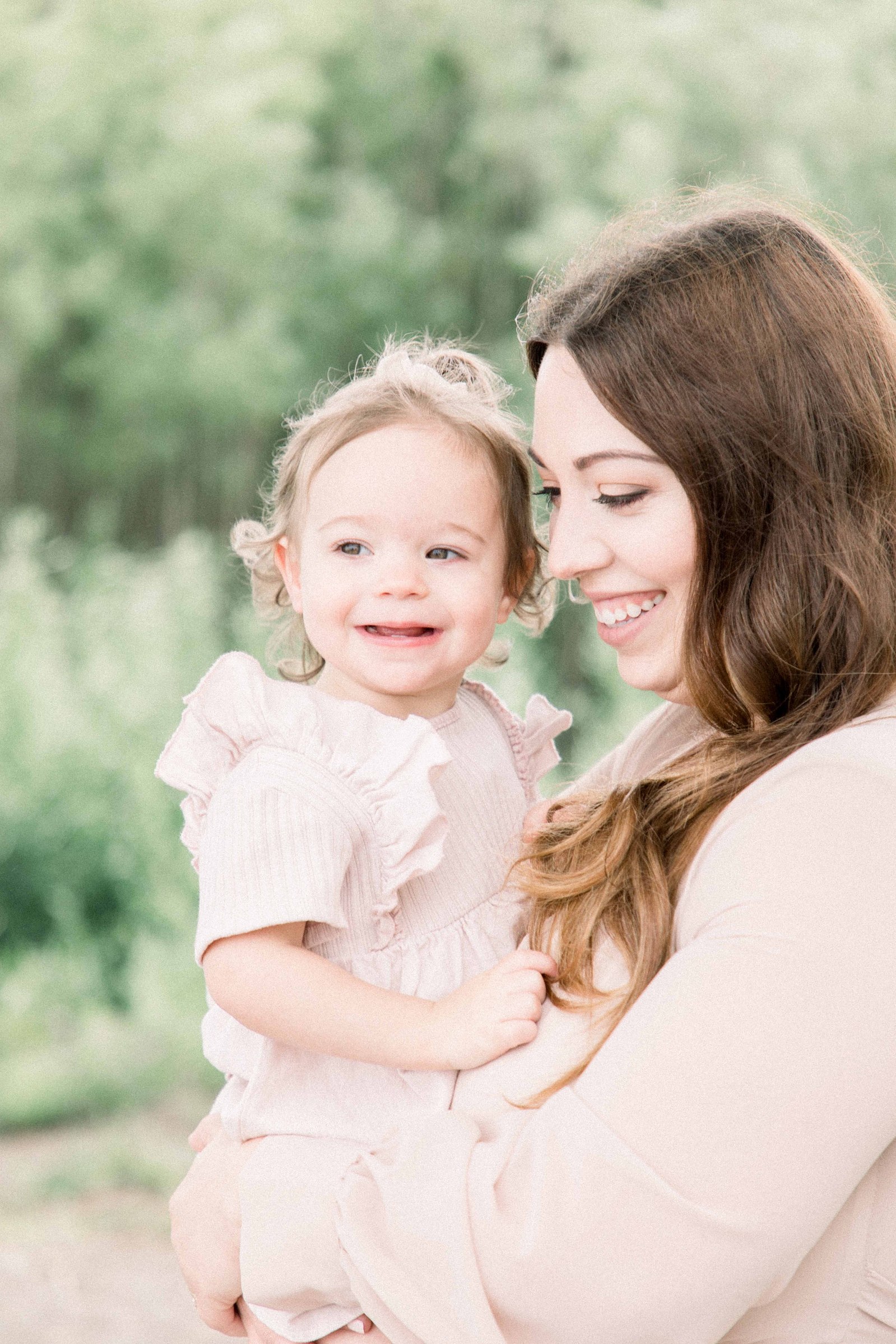 Portrait of mother and daughter smiling on the beach, Niagara Portrait Photographer, Niagara Family Photographer, Niagara Motherhood Photography, Beach Portrait Photography, Emily VanderBeek Photography.