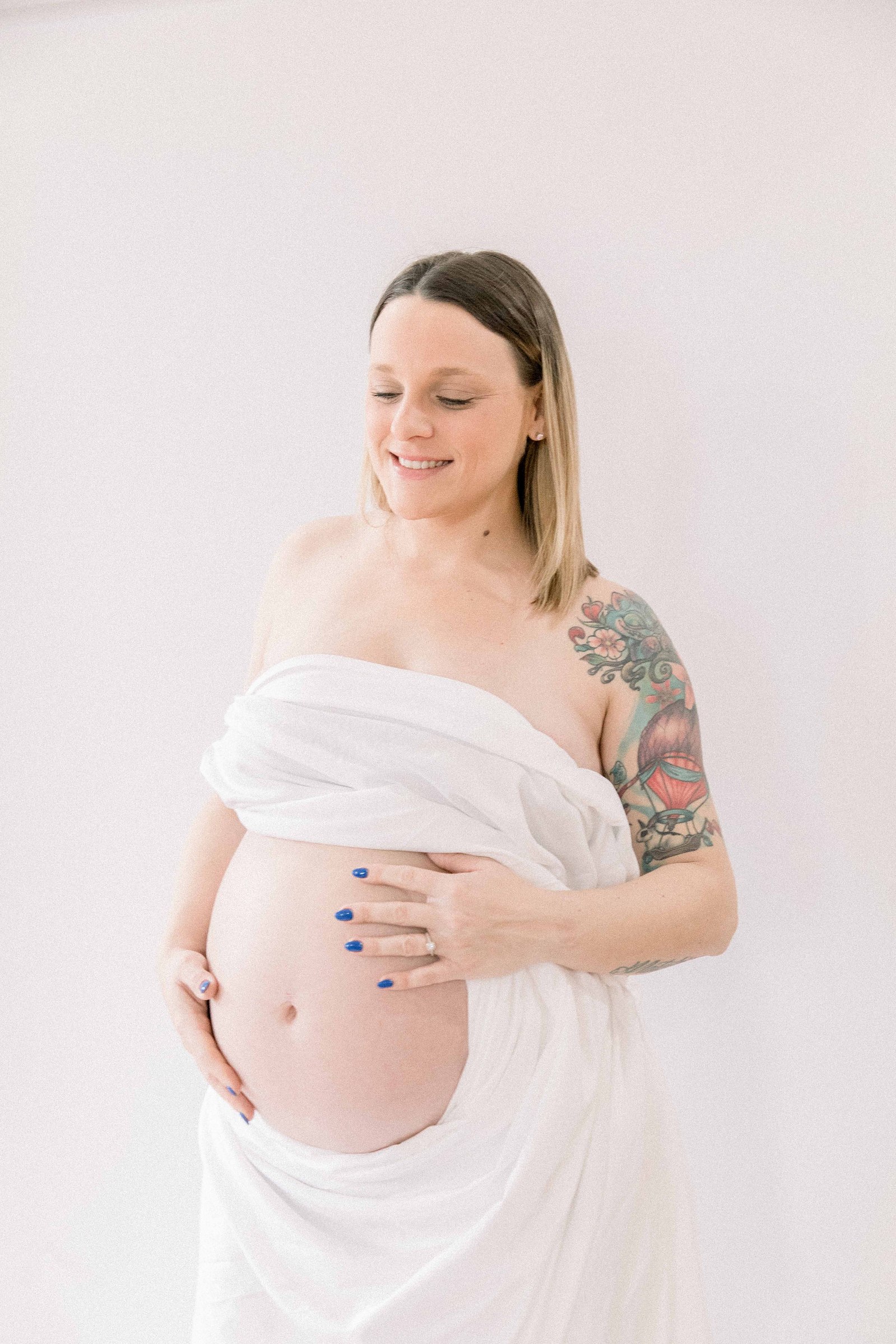 Studio portrait of a pregnant mother. Ottawa Maternity Photographer, Montreal Maternity Photographer, Motherhood Photography, Authentic Photography, Light & Airy Photography, Emily VanderBeek Photography.