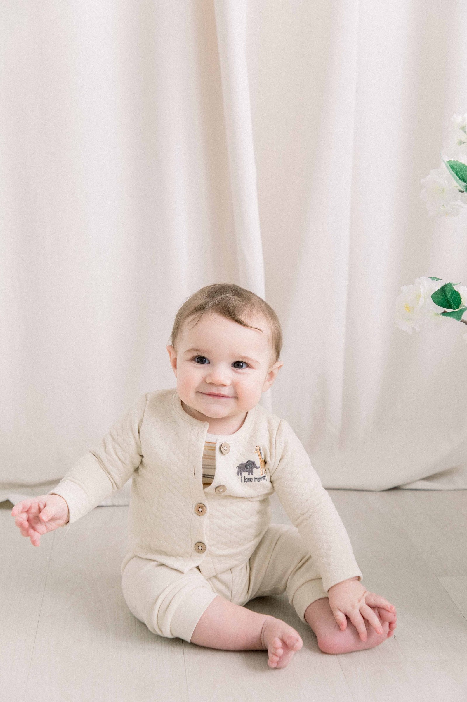 Portrait of a baby boy smiling in a studio. Emily VanderBeek Photography. Ottawa family photographer. Candid photography.